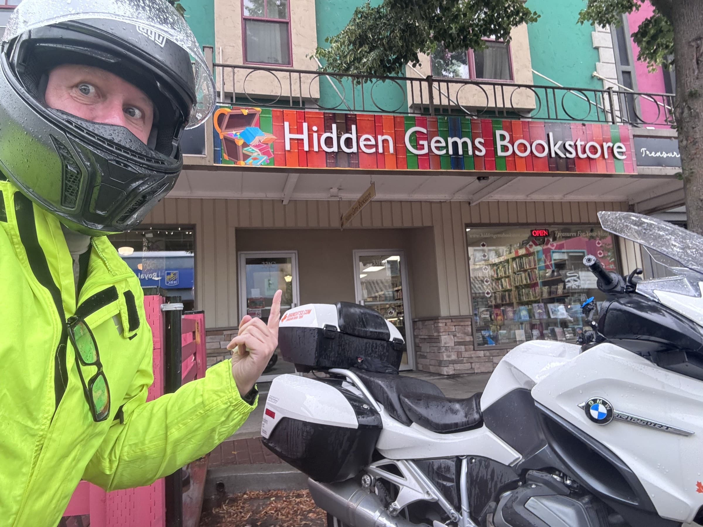 Michael Dargie outside Hidden Gems Bookstore in BC on the BrandJitsu® Canadian Book Tour, motorcycle in foreground