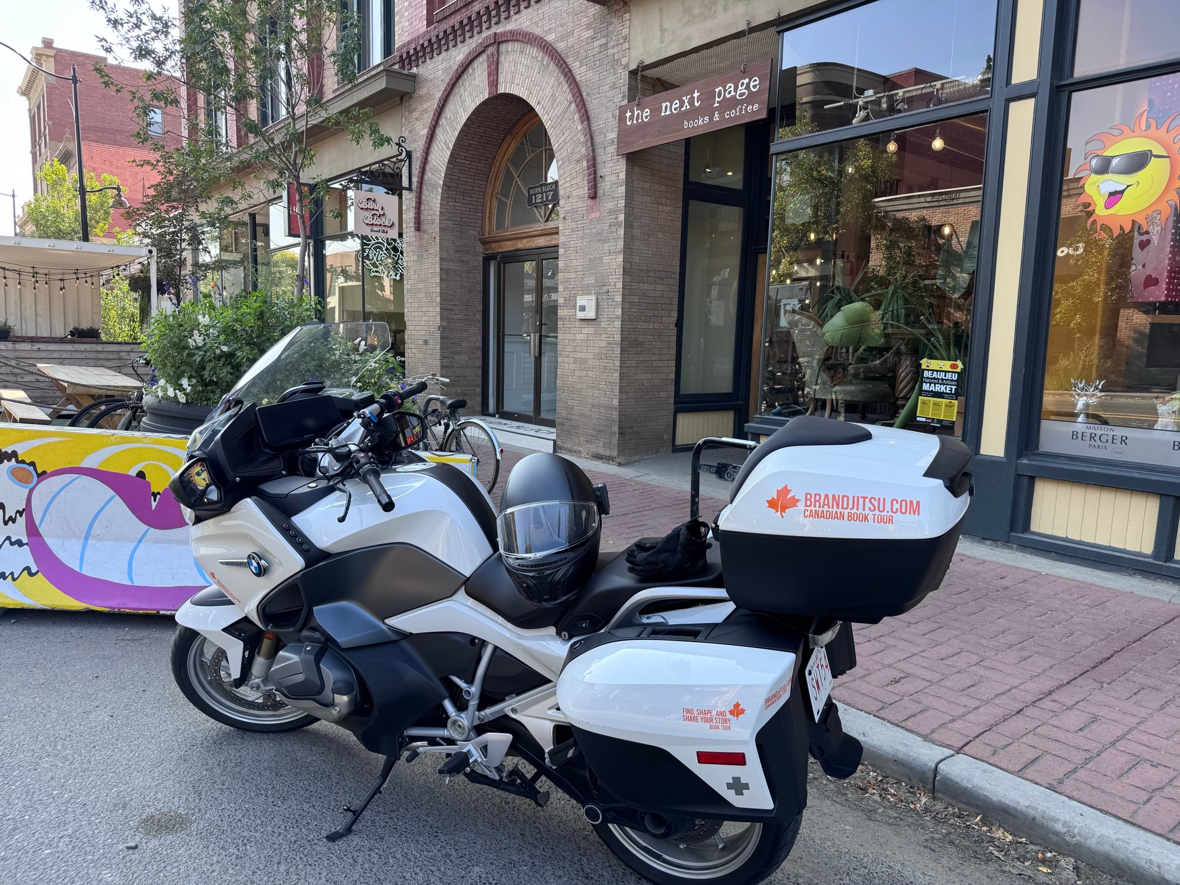 BrandJitsu® Canadian Book Tour motorcycle parked outside the Next Page Books & Coffee